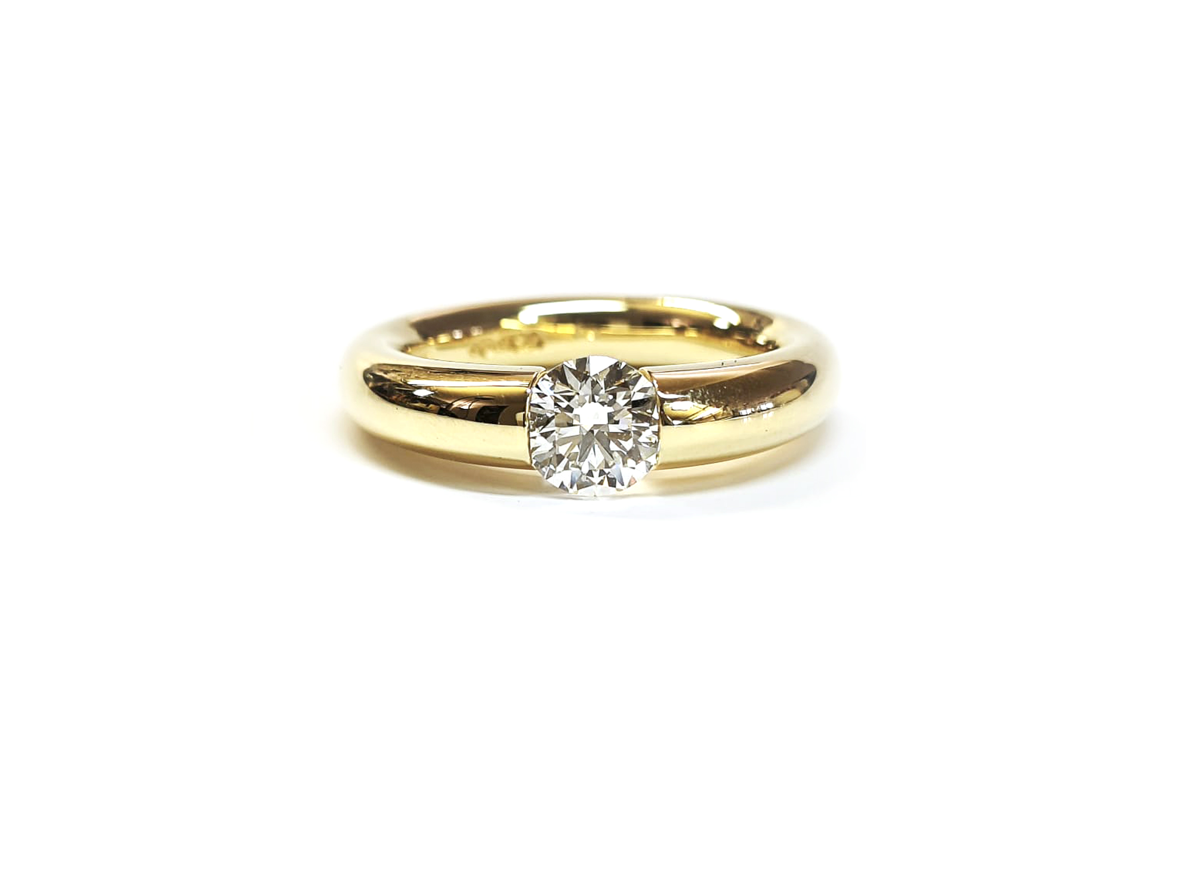 Niessing Spannring Verlauf in Gelbgold Brillant 0,81ct